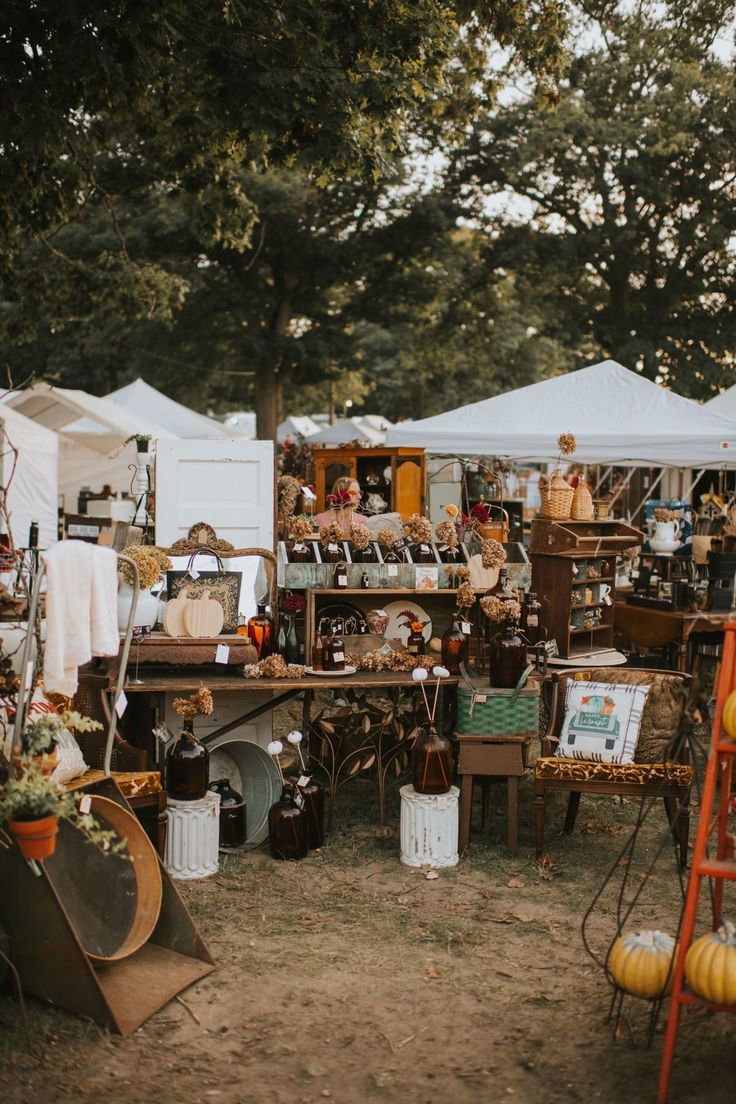 Layered outdoor vintage market stall with products displayed at different heights