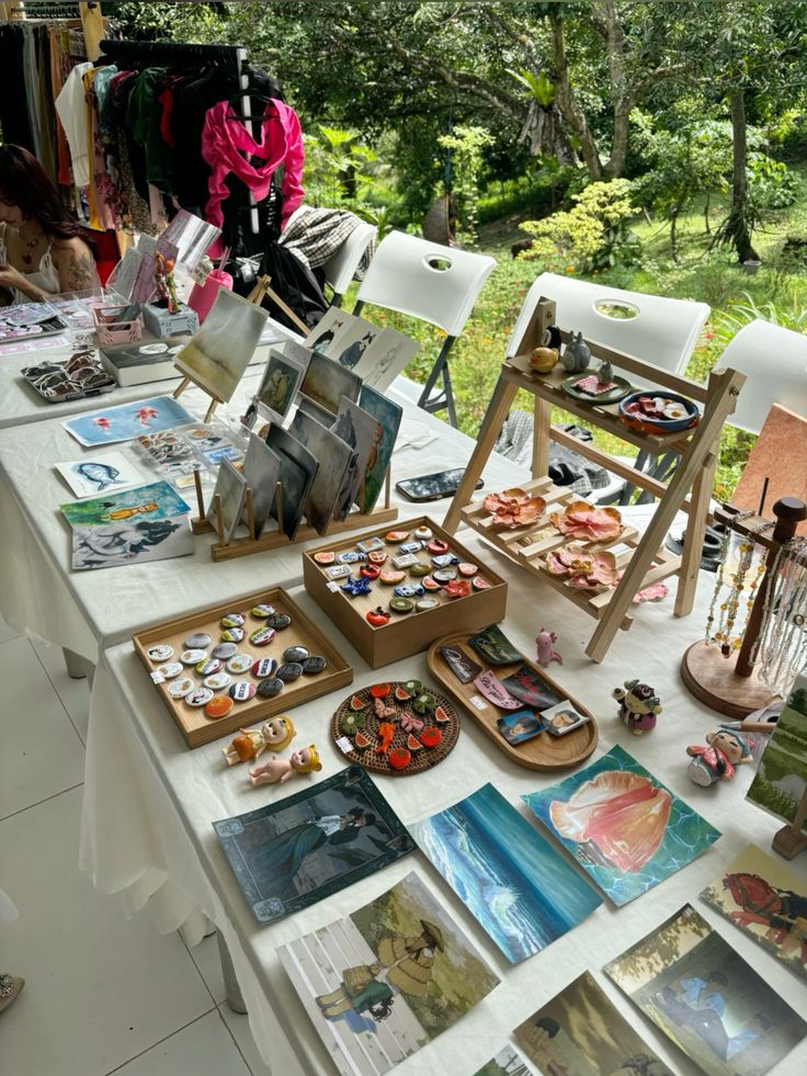 Creative market table using risers, trays and open space to organise small works